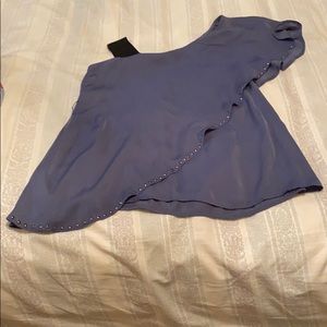 Blouse just one shoulder.